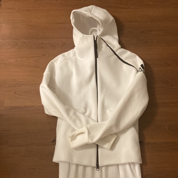 White sporty suit of the brand Adidas. It’s an X-small. Never wear and new. - Picture 2 of 3